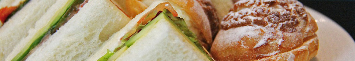 Eating Deli Sandwich at Mac's Deli & Catering restaurant in Scarborough, ME.
